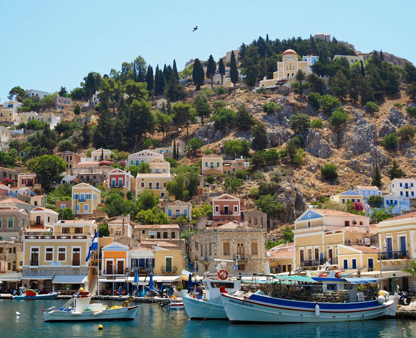 Traditional Dodecanese harbor — Symi, the kind of waters Triton Marine serves
